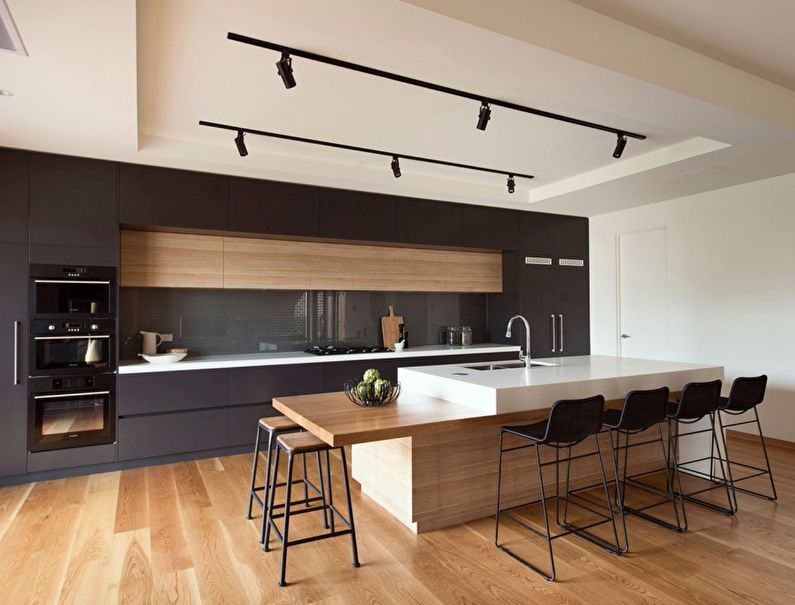 Design of a kitchen with an island in the style of minimalism - photo