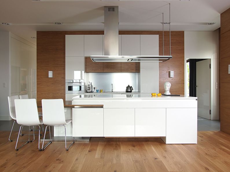 Design of a kitchen with an island in the style of minimalism - photo