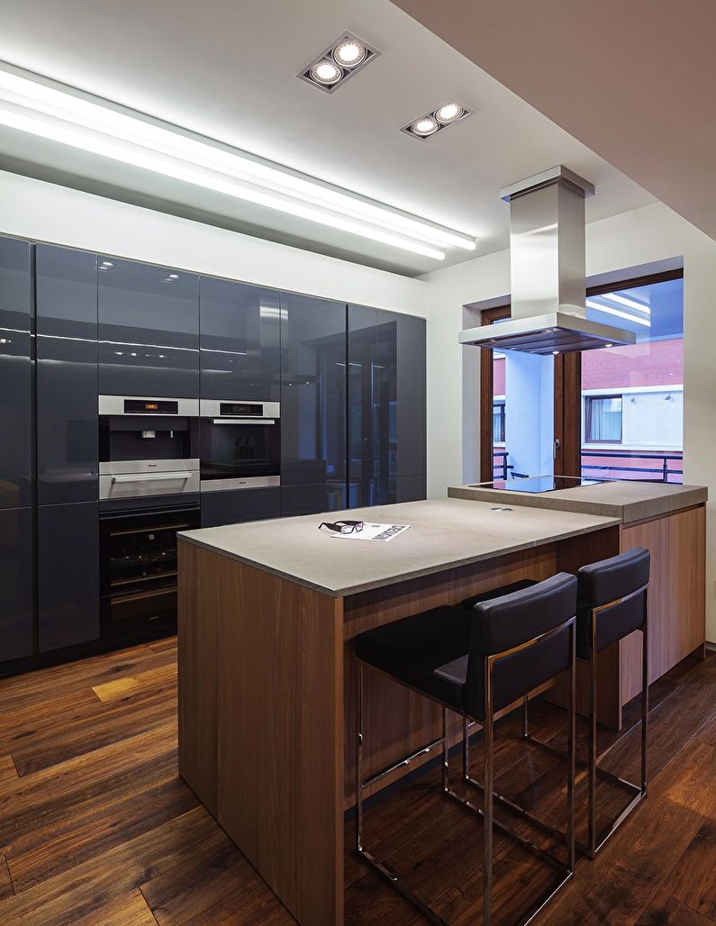 Design of a kitchen with an island in the style of minimalism - photo