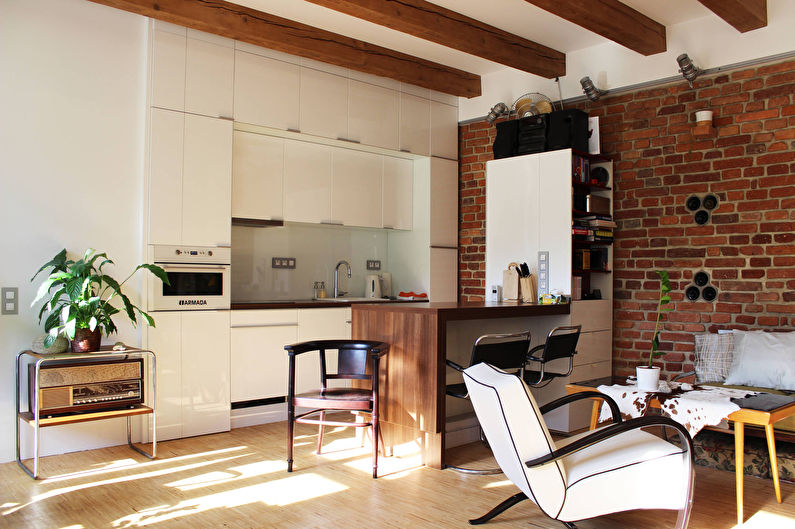 Design of a kitchen-living room in the loft style - photo