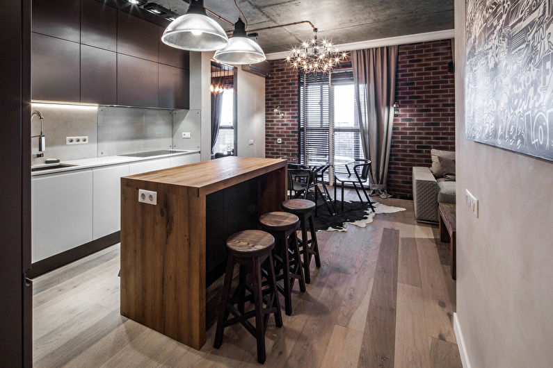Design of a kitchen-living room in the loft style - photo