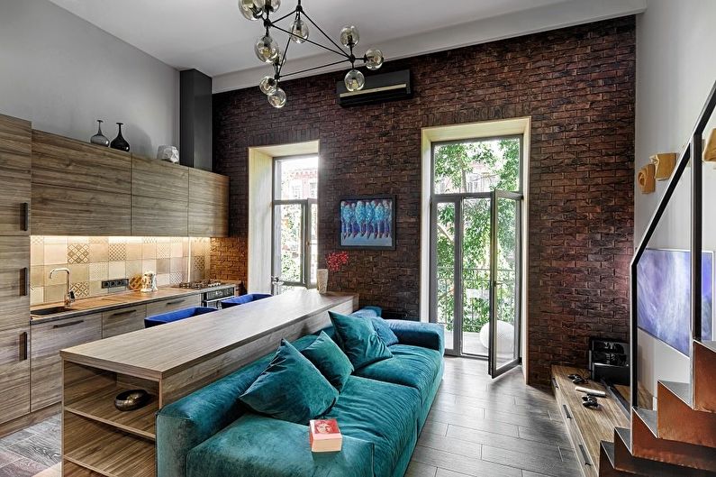 Design of a kitchen-living room in the loft style - photo