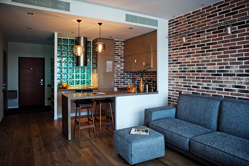 Design of a kitchen-living room in the loft style - photo