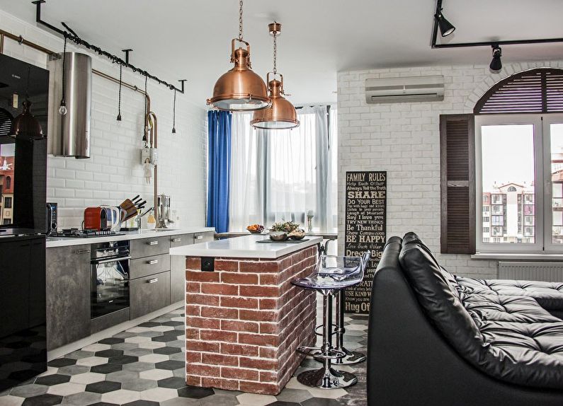 Design of a kitchen-living room in the loft style - photo