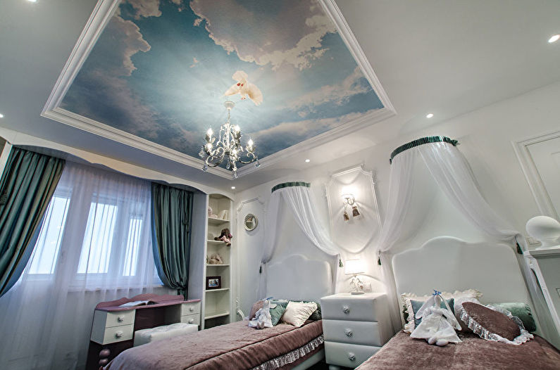 Stretch ceiling with photo printing in the interior of the nursery