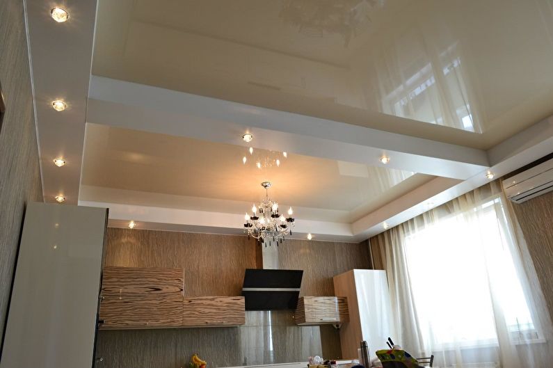 Glossy stretch ceiling in the kitchen - photo