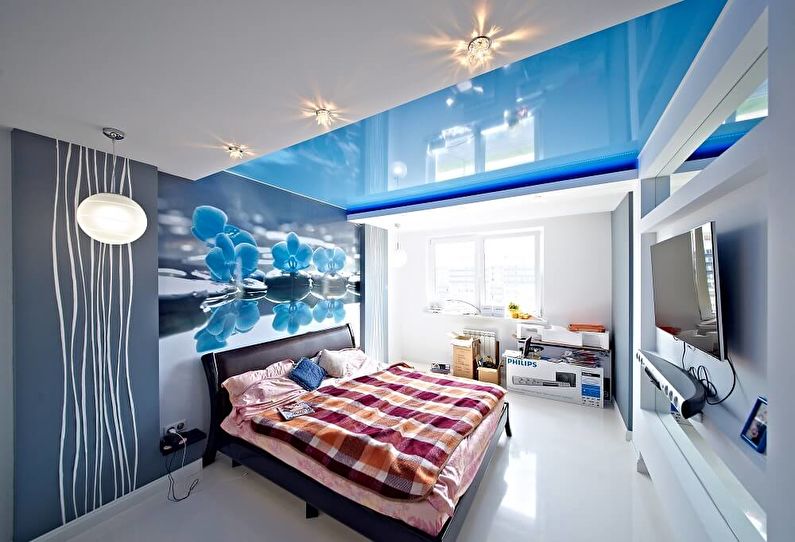 Blue stretch ceiling in the bedroom - photo