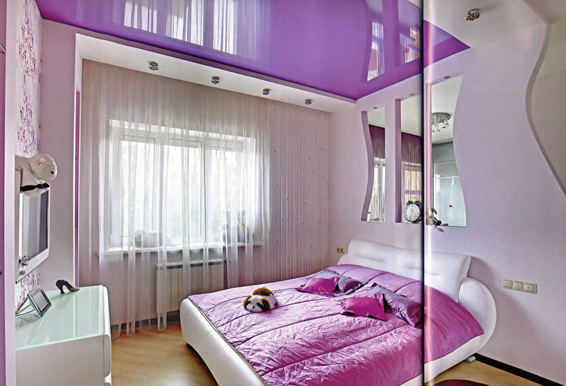 Pink stretch ceiling in the bedroom - photo