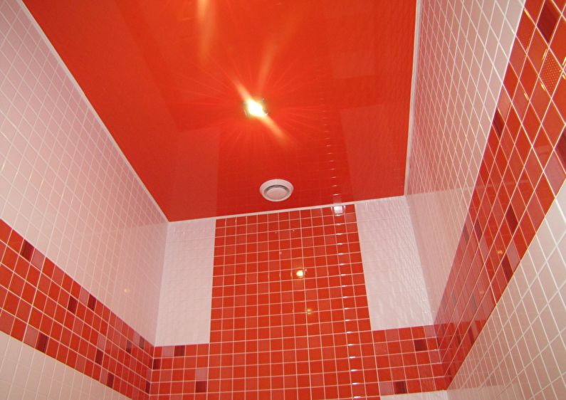 Red stretch ceiling in the bathroom - photo