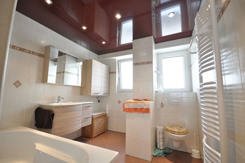 Brown stretch ceiling in the bathroom - photo