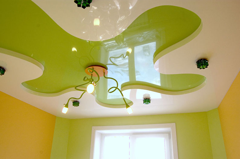 Green stretch ceiling in a children's room - photo