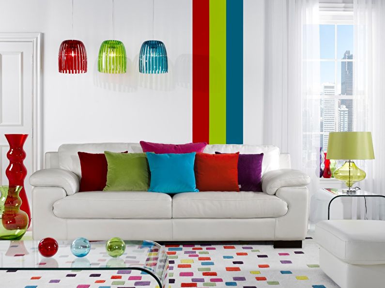 The combination of colors in the interior of the living room - white with red, green and blue