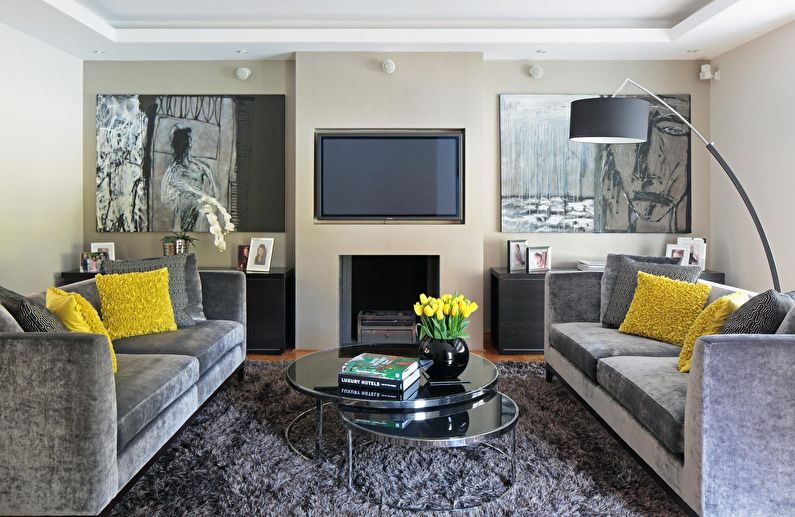 The combination of colors in the interior of the living room - gray with beige and white