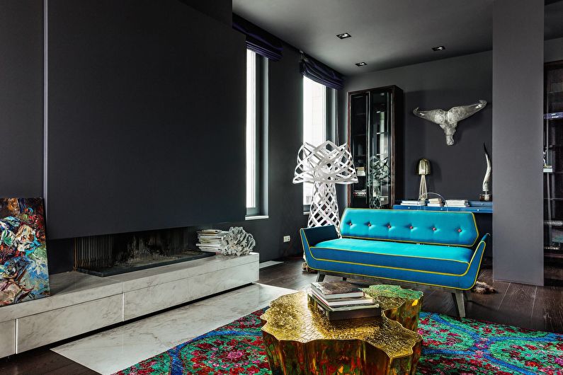 The combination of colors in the interior of the living room - black with turquoise