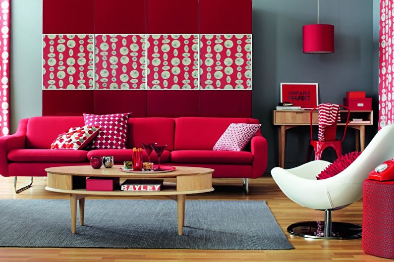 The combination of colors in the interior of the living room - red with gray