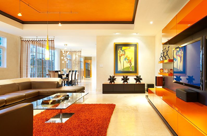 The combination of colors in the interior of the living room - orange with white and brown