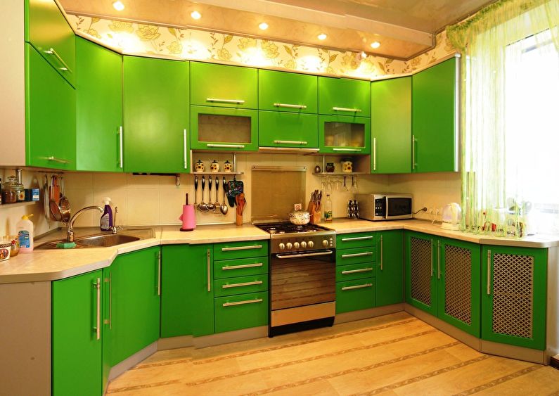 The combination of colors in the interior of the kitchen - green with beige