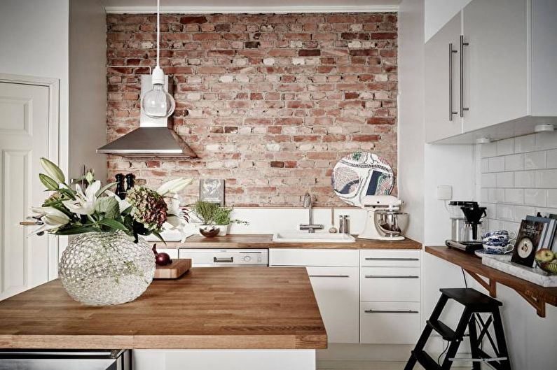 Brick wall in the interior of the kitchen - photo