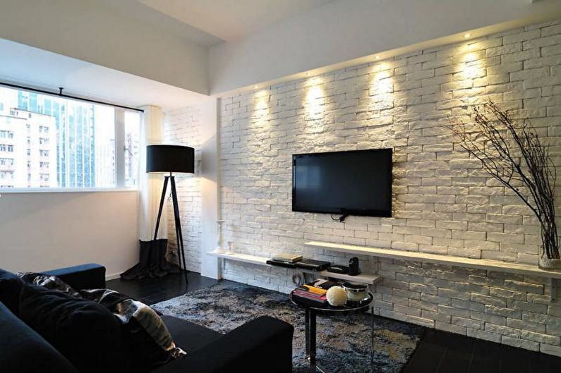Brick wall in the living room interior - photo