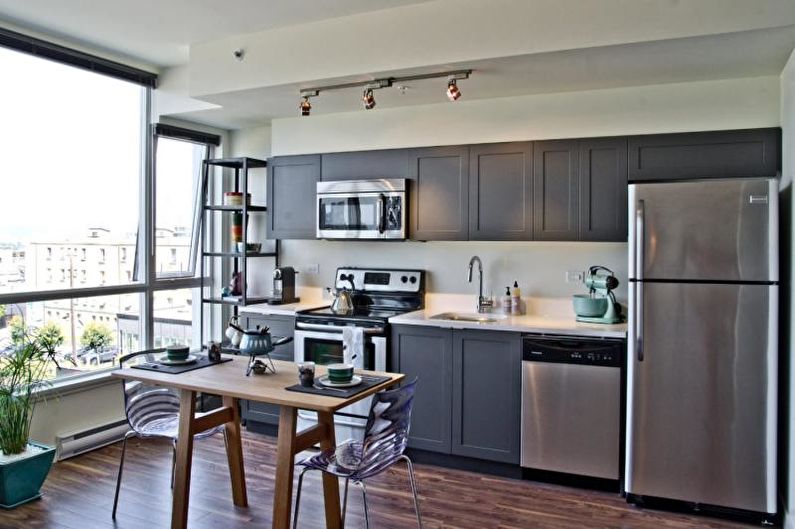 Kitchen interior design in gray - photo