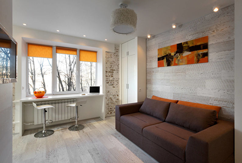 Inredning av ett vardagsrum i Khrushchev - loft, minimalism