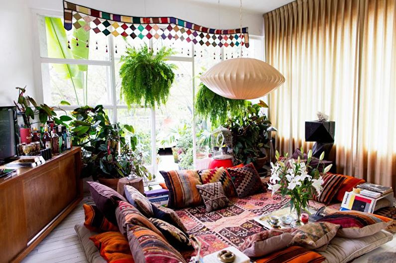 Living room in a country house in ethnic style - Interior Design