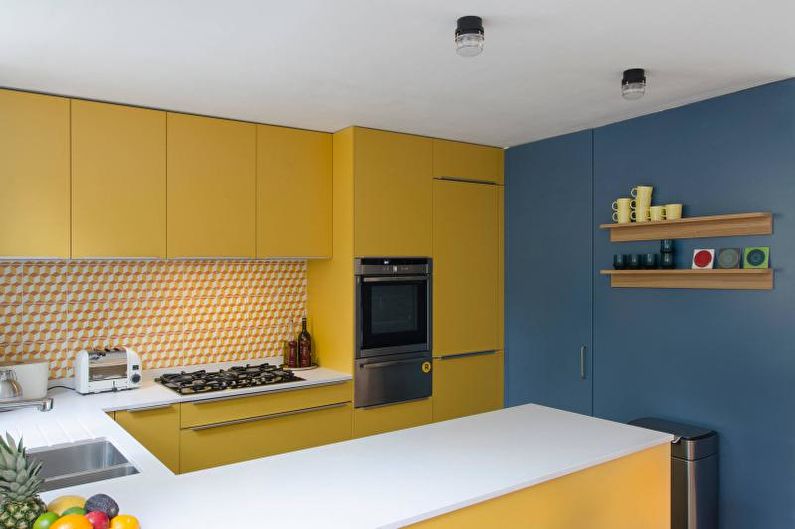 Kitchen interior design in yellow - photo