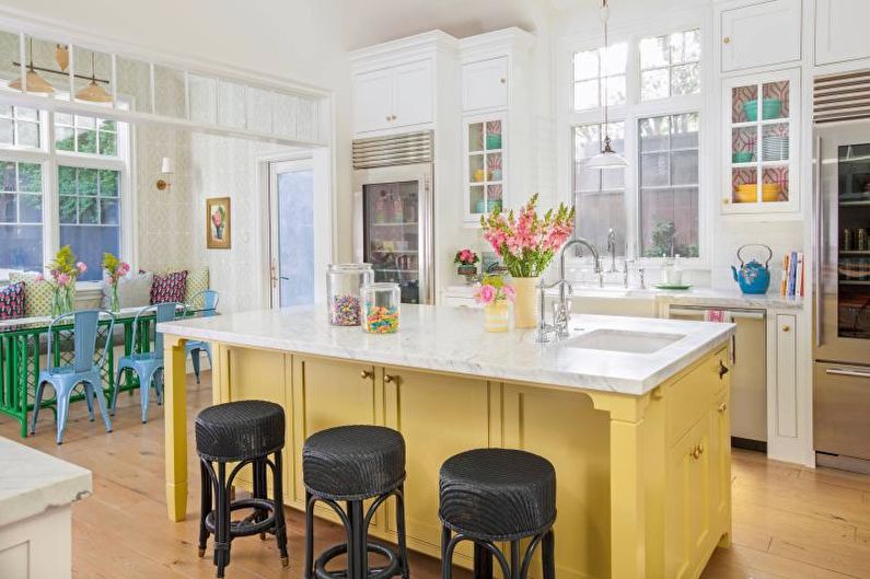 Kitchen interior design in yellow - photo