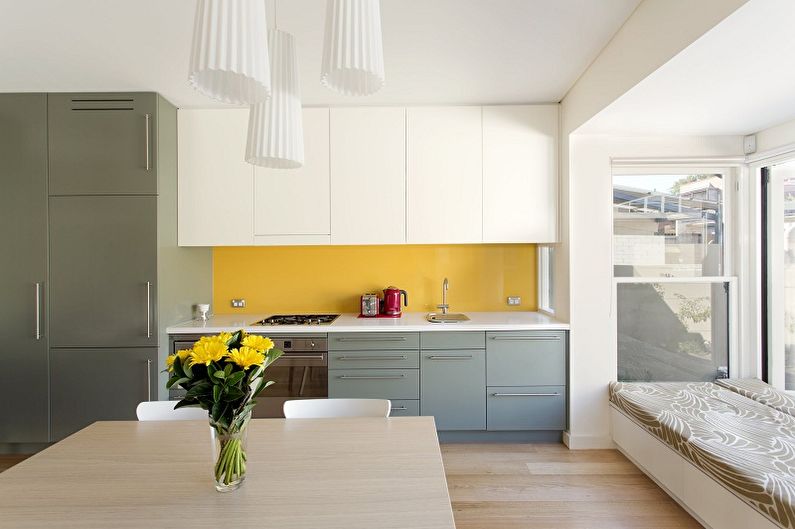 Kitchen interior design in yellow - photo