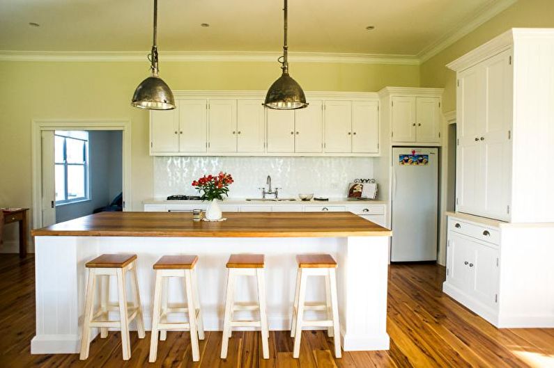 Kitchen interior design in yellow - photo