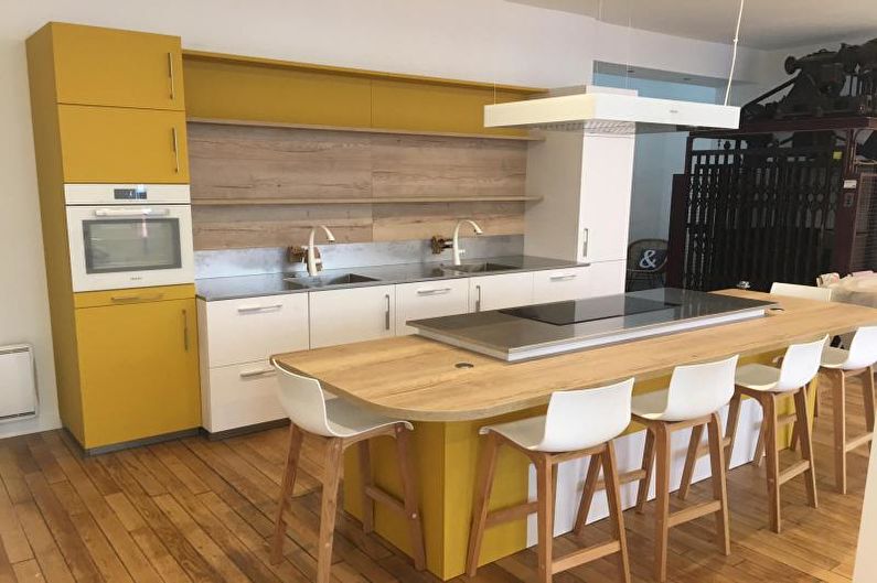 Kitchen interior design in yellow - photo