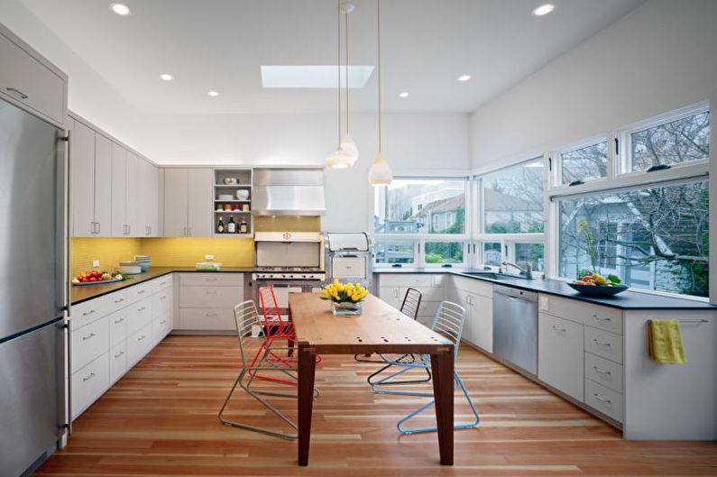 Kitchen interior design in yellow - photo