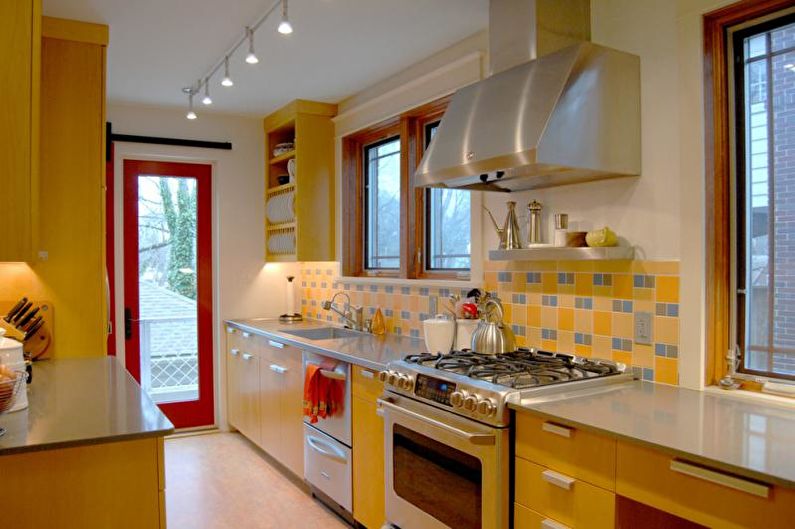 Kitchen interior design in yellow - photo