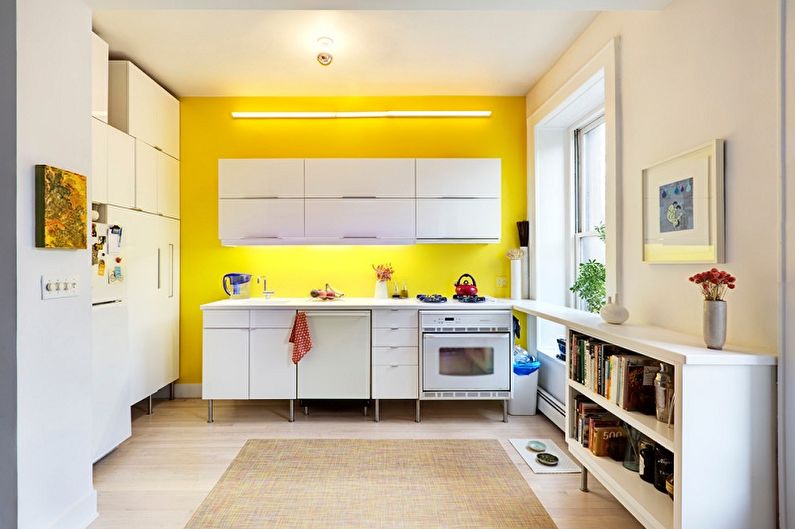 Kitchen interior design in yellow - photo