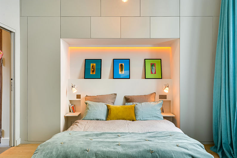 Interior design of a bedroom in Khrushchev - Modular wall above the headboard