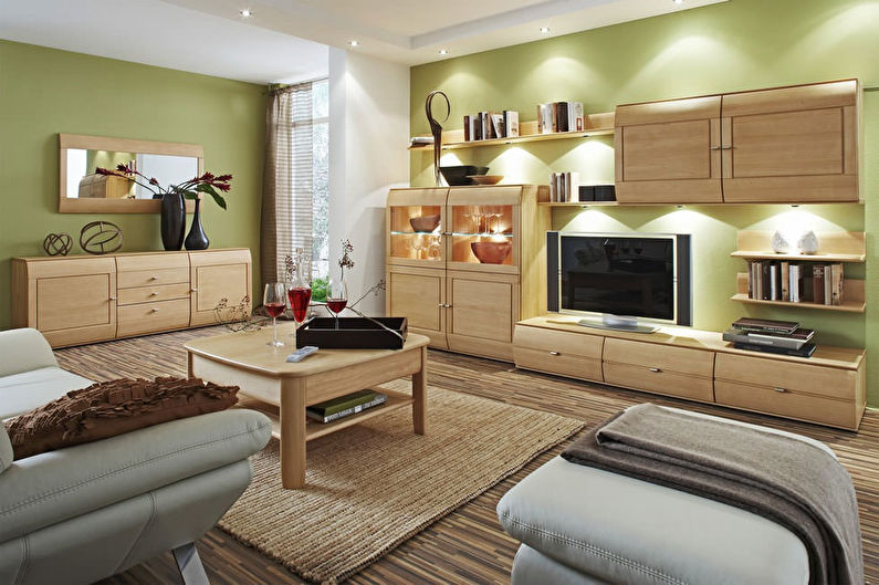 Green color in the interior of the living room - photo
