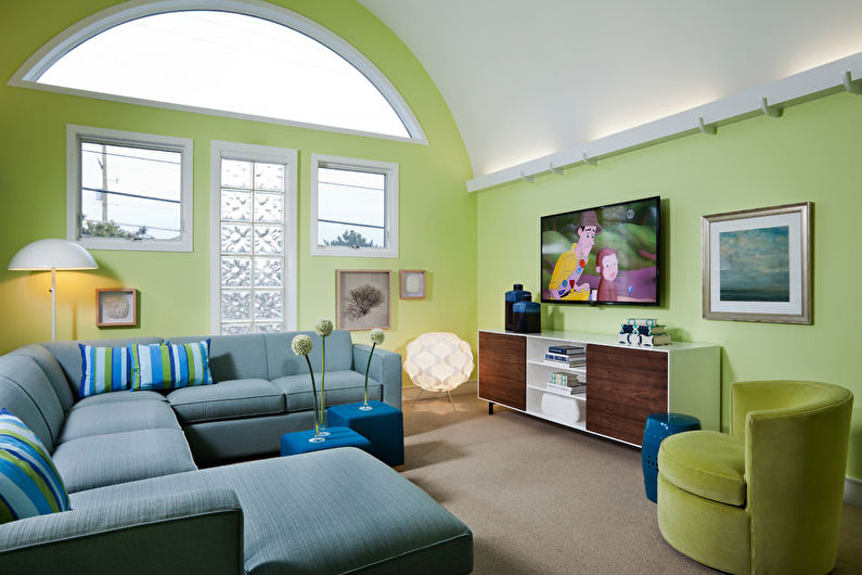 Green color in the interior of the living room - photo