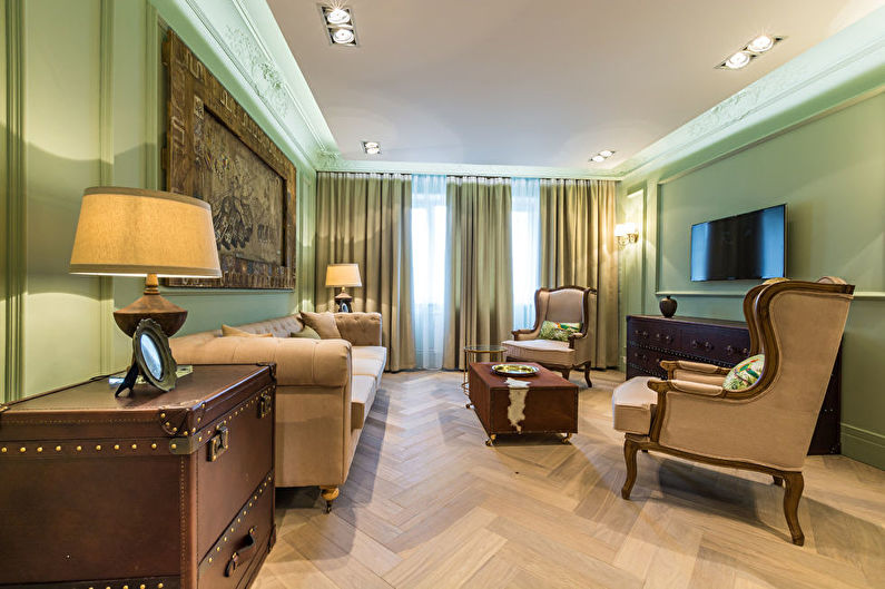 Green color in the interior of the living room - photo