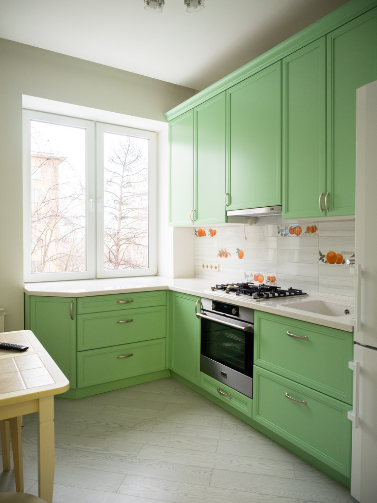 Green color in the interior of the kitchen - photo