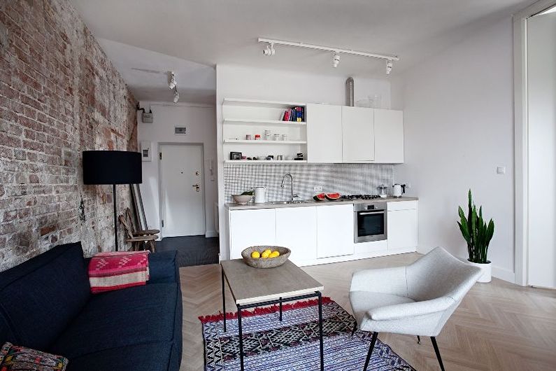 Interior design of a kitchen-living room in a small apartment - photo
