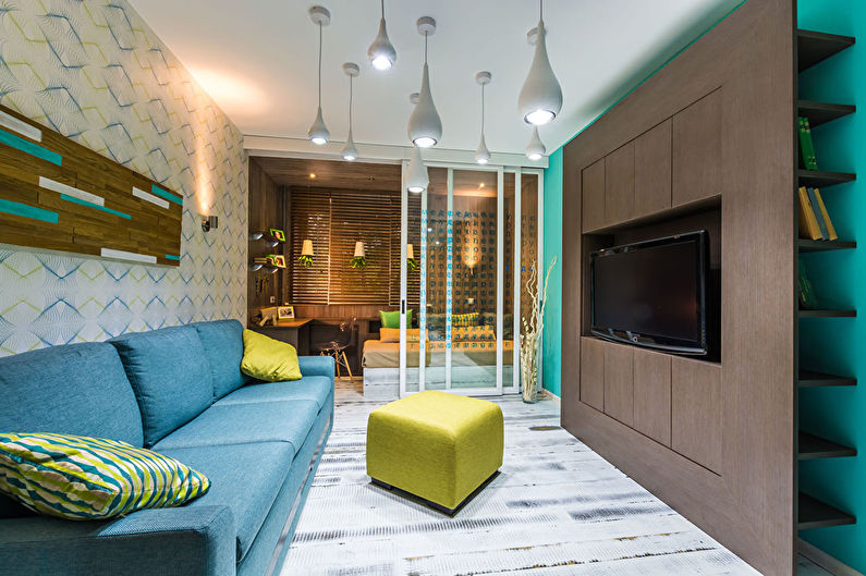 Zoning of the nursery and living room in a studio apartment