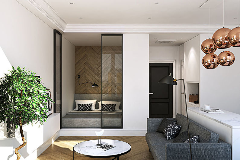Zoning of the bedroom and living room in a studio apartment