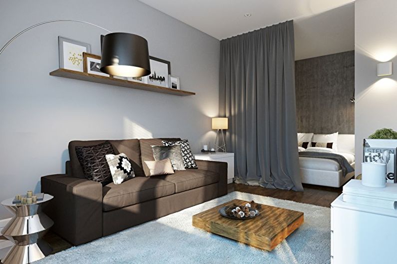 Zoning of the bedroom and living room in a studio apartment