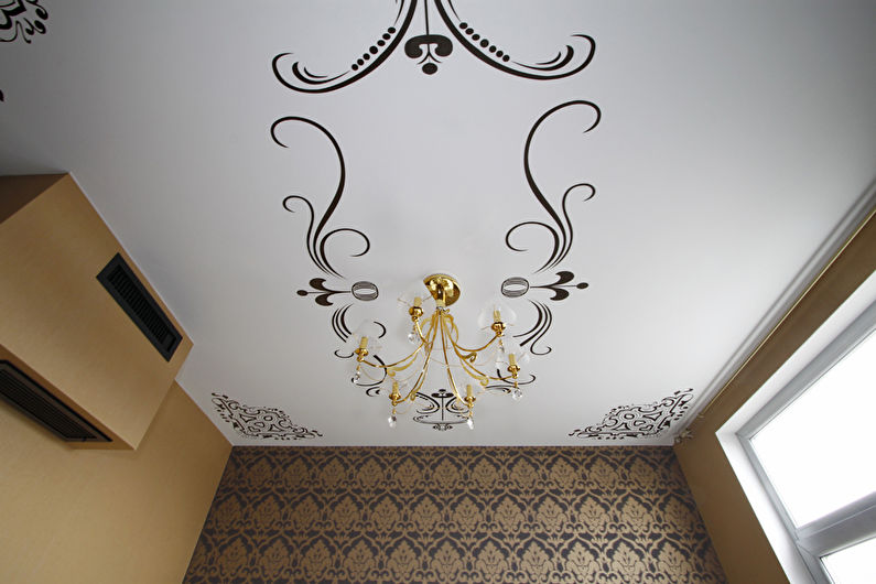 Stretch ceilings with drawings in the bedroom