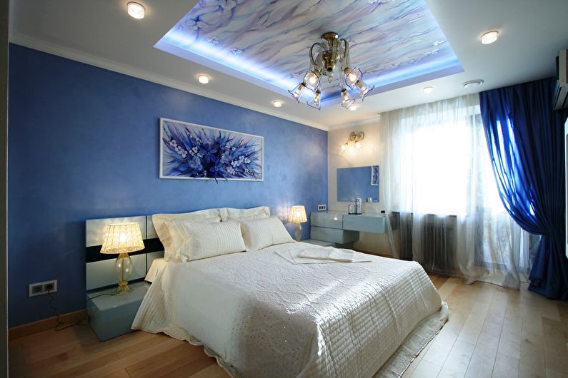 Stretch ceilings in the bedroom - photo