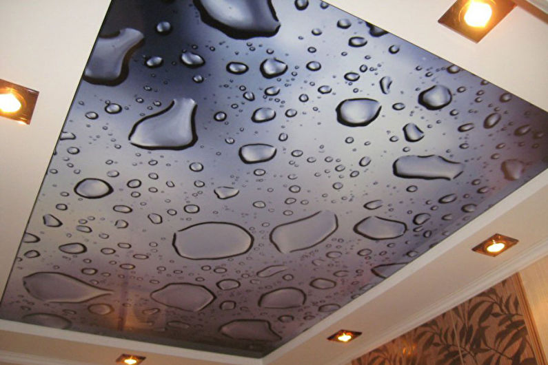 Stretch ceilings in the bedroom - photo