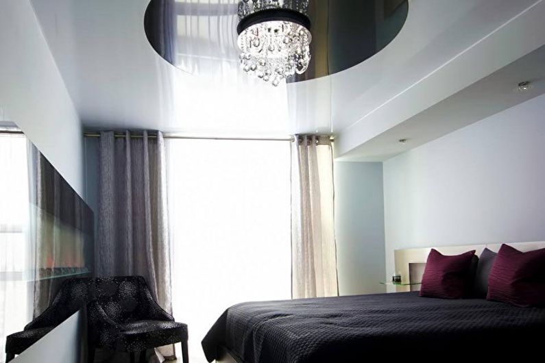 Stretch ceilings in the bedroom - photo