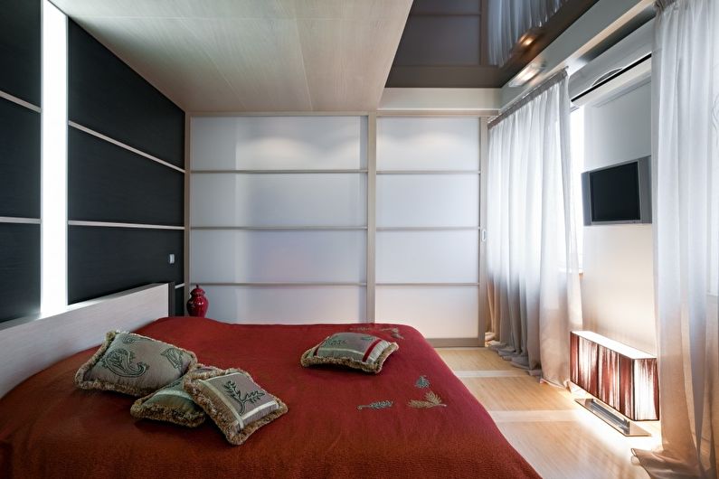 Stretch ceilings in the bedroom - photo