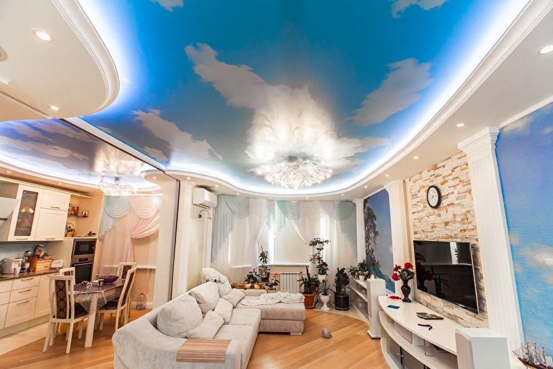 Stretch ceilings in the living room - photo