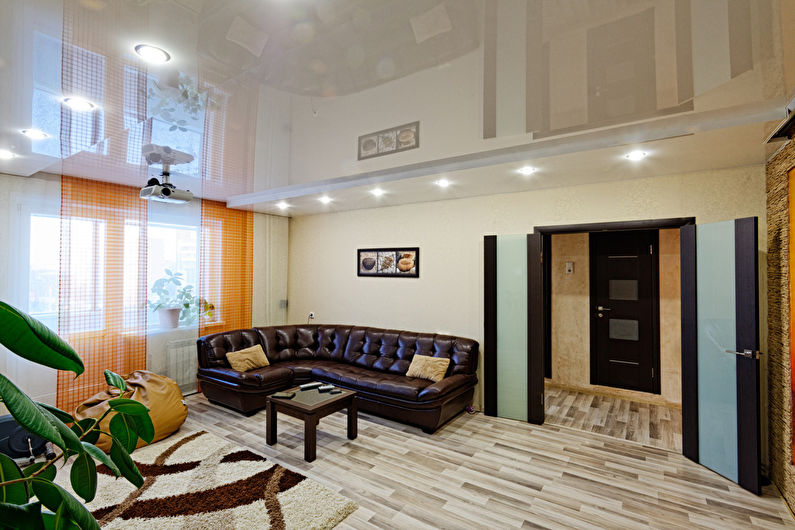 Stretch ceilings in the living room - photo